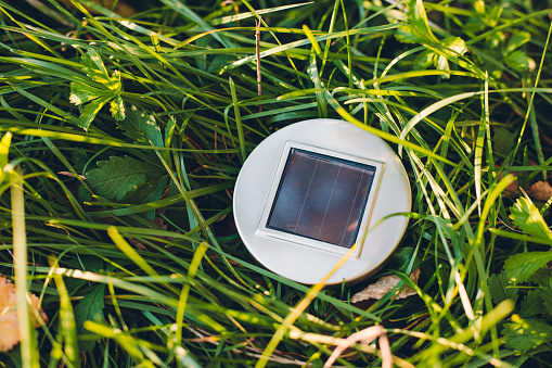 Solar cell model on green field.