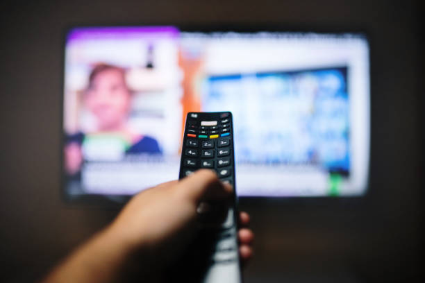 istock Changing the TV channel with a remote 1219716518