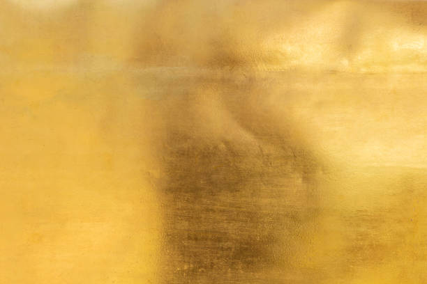 istock Shiny yellow leaf gold foil texture background 1219717504