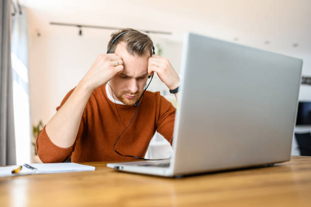 istock The guy uses hands-free headsets to work from home 1219719040