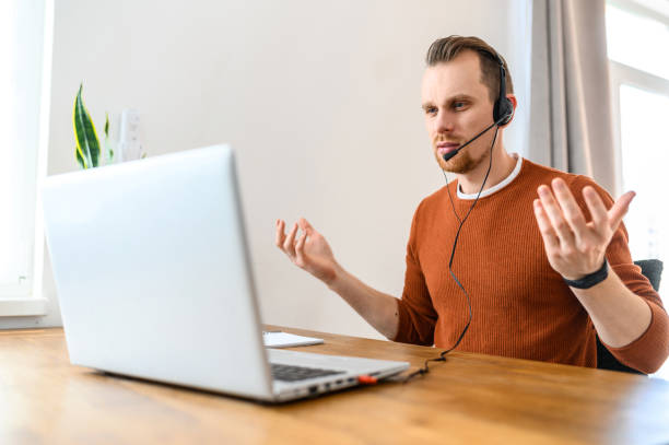 istock The guy uses hands-free headsets to work from home 1219719046