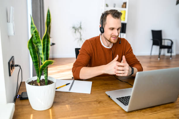 istock The guy uses hands-free headsets to work from home 1219719055