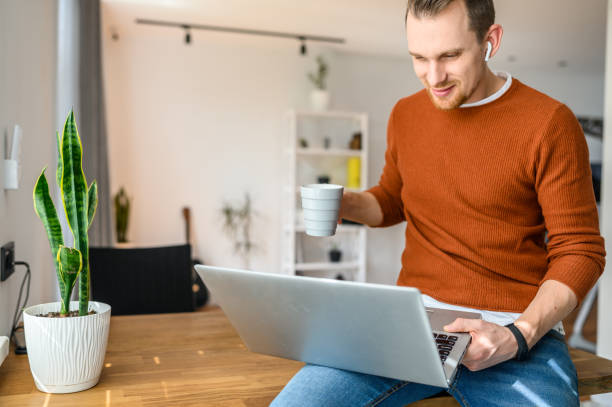 istock Home office. A young businessman uses laptop 1219719144
