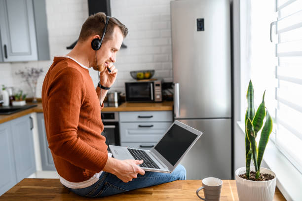 istock The guy uses hands-free headsets to work from home 1219719147