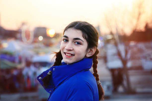 istock Girl in amusement park 1219719165