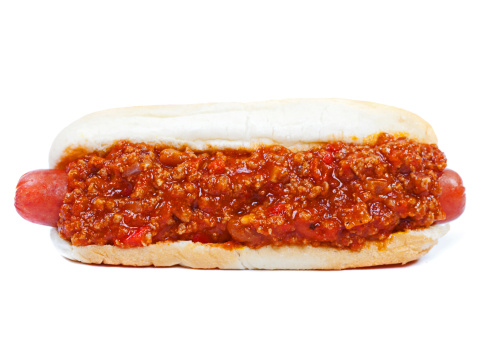 Chili hot dog in a bun isolated on white