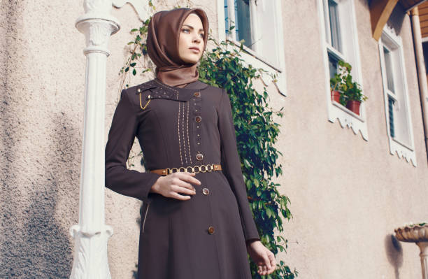 Modern young muslim woman looking away