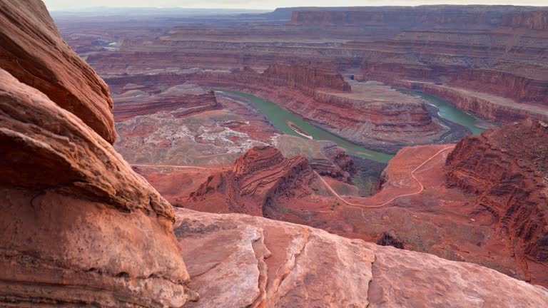 Dead Horse Point State Park, Utah, USA. Сamera moves over a cliff, view of canyon and colorado river. Steadicam shot, 4K