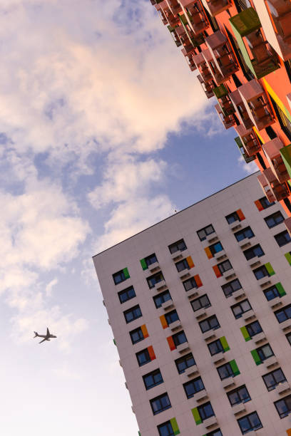 istock The plane over the apartment block. 1219723469