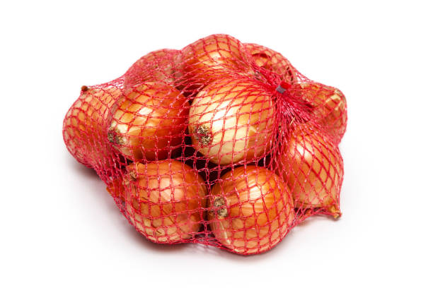 istock onions in a red packing net isolated on white background 1219723636