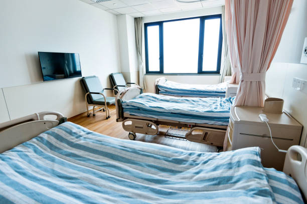 istock Hospital ward with beds and armchairs 1219724995