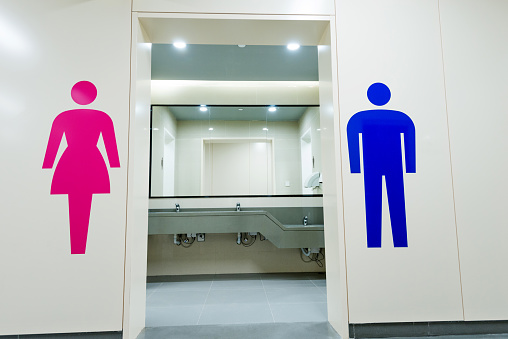 Public toilets with men and women signs.