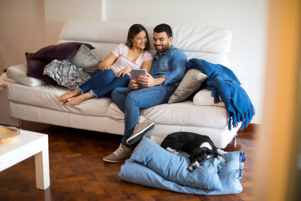 istock Couple relaxing on the sofa during lockdown 1219725895