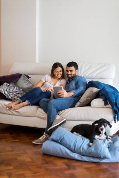 Couple relaxing on the sofa during lockdown