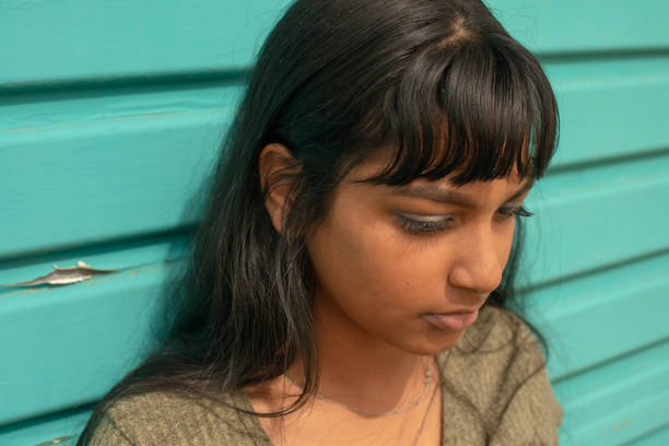istock Young woman against green background 1219726488