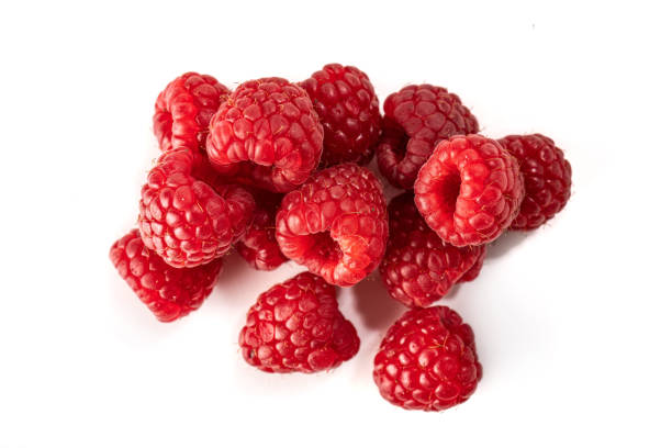 istock Ripe red raspberries on a white background 1219726520