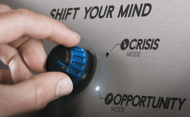Turning crisis into an opportunity. Concept Man turning a knob to turn crisis into an opportunity. Composite image between a hand photography and a 3D background. turning photos stock pictures, royalty-free photos & images