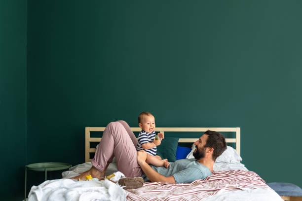 istock Morning Cuddles: Father and his Baby Boy Enjoying a Weekend Morning 1219729078