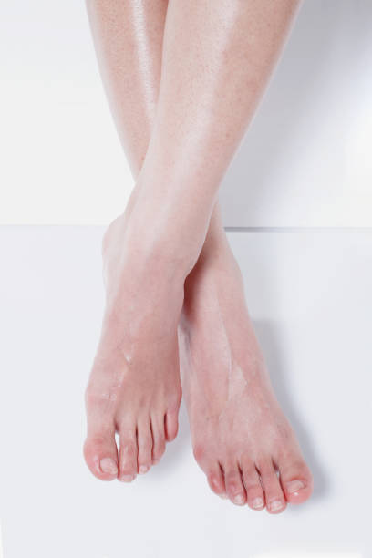 istock moist, smooth feet and ankles. 1219729141