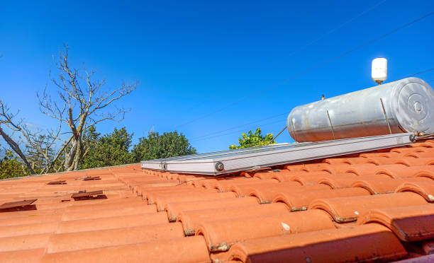 istock Solar Energy Electric Boiler on an orange roof 1219729173