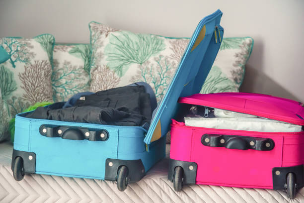 istock Trolley suitcases open in a hotel room 1219729663