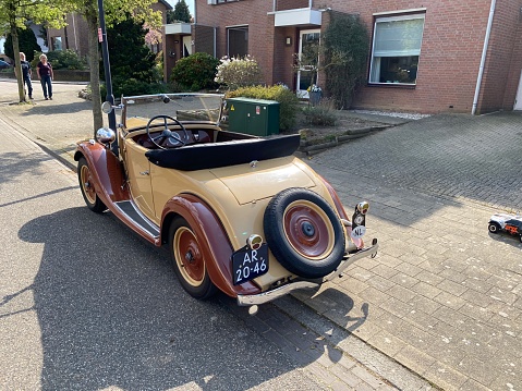 Brunssum, the Netherlands, - April 19, 2020. Vintage history  cars, parked in the city Street.