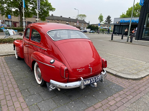 Brunssum, the Netherlands, - April 19, 2020. Vintage history  cars, parked in the city Street.