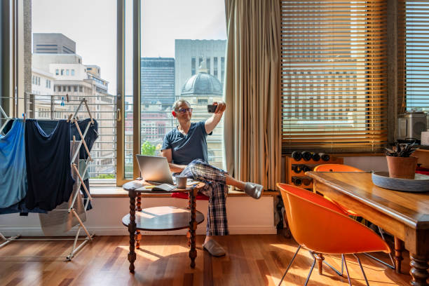 istock A man working from home dressed in pajamas during Cape Town coronavirus lockdown 1219731992