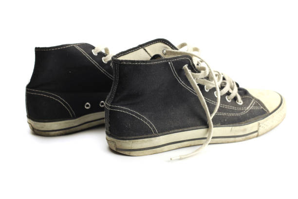 istock Sneakers old dirty grunge isolated on white 1219732116