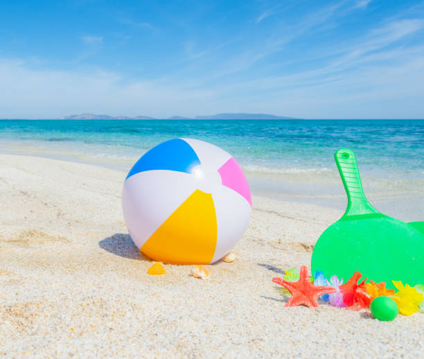 istock Beach ball and rackets on the sand 1219733061