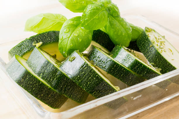 istock green zucchini slices in glass bowl with basilicum 1219733463
