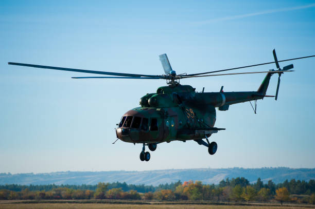 istock Military helicopter flying during exercise 1219733561