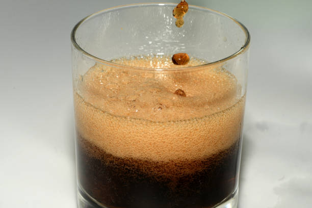 istock carbonated drink is poured into a glass 1219735507