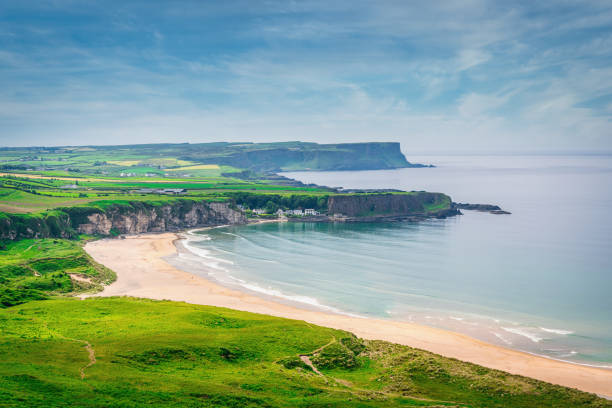 Whitepark Bay Beach Portbradden Harbour Coast of Northern Ireland Beautiful view to the green natural White Park Bay Beach in Summer. Whitepark Bay Beach, Dunseverick - Portbradden, Antrim County, Northern Ireland, UK, Europe rocky coastline stock pictures, royalty-free photos & images