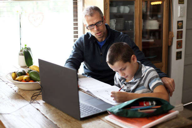 istock Father and son home schooling 1219736533