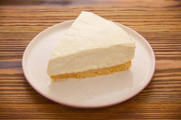istock classic cheesecake on white plate on  wooden table 1219736984