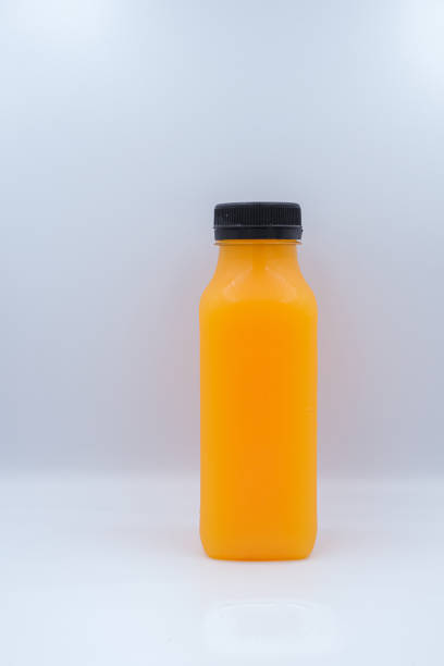 istock Group of orange juice glass bottle isolated on white background. 1219737270