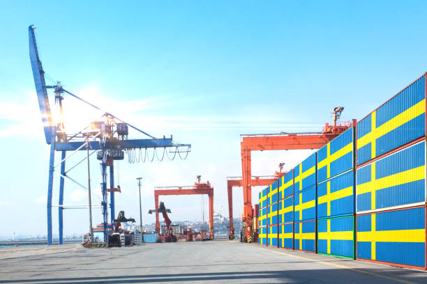 istock The crane is hoisting Shipping cargo containers with SWEDEN flag 1219737324
