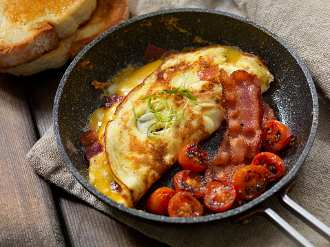 Bacon and Cheese Omelette with Cherry Tomatoes and Toasted Bread