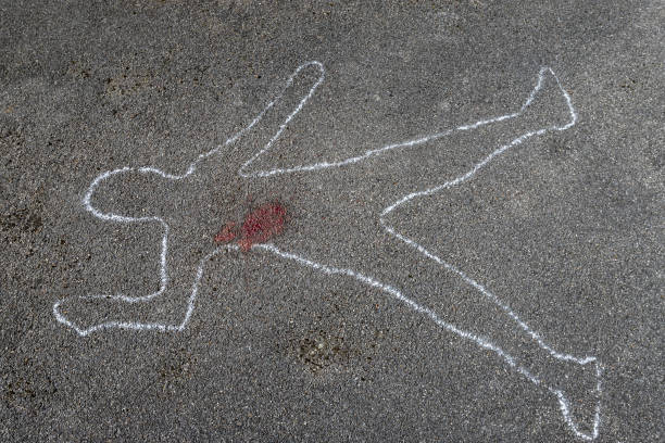 istock outline of a body on asphalt 1219738243