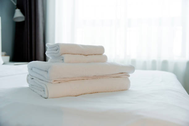 Extreme close-up of used white cotton towel texture background.