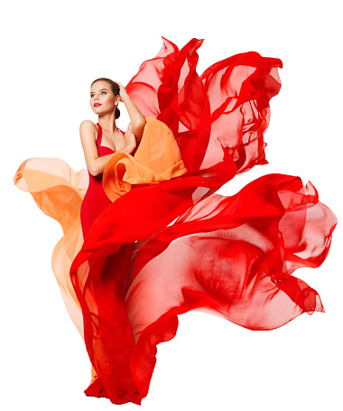 Woman Waving Red Dress Fluttering as Flame, Flowing Silk Cloth, Beautiful Fashion Model in Artistic color Fabric on isolated White background