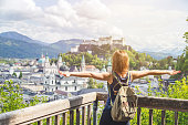 Holiday in Salzburg: Young girl is enjoying the view. Historic district, Festung Hohensalzburg