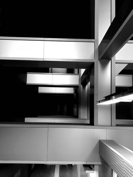 istock Internal structure of columns that support each other. In an attitude of mutual support. Concept image in black and white. 1219742013
