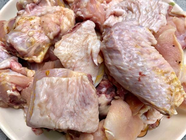 istock Raw chicken meat cut down into small pieces for cooking 1219742480