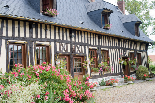 La Neuville-Chant-d'Oisel (Seine-Maritime, Haute Normandie, France) - Exterior of old half-timbered house with flowers