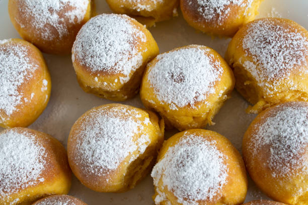 istock Round buns sprinkled on a white plate top view 1219743844
