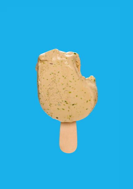 istock half eaten matcha popsicle on a blue background 1219745719