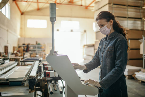 istock Woman working in industry at machine 1219747223