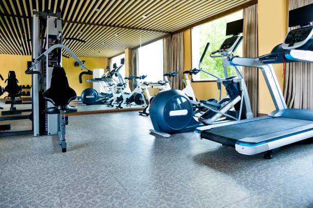 istock Group of exercise machines in gym room 1219747389